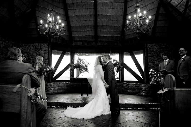 bride and groom first kiss