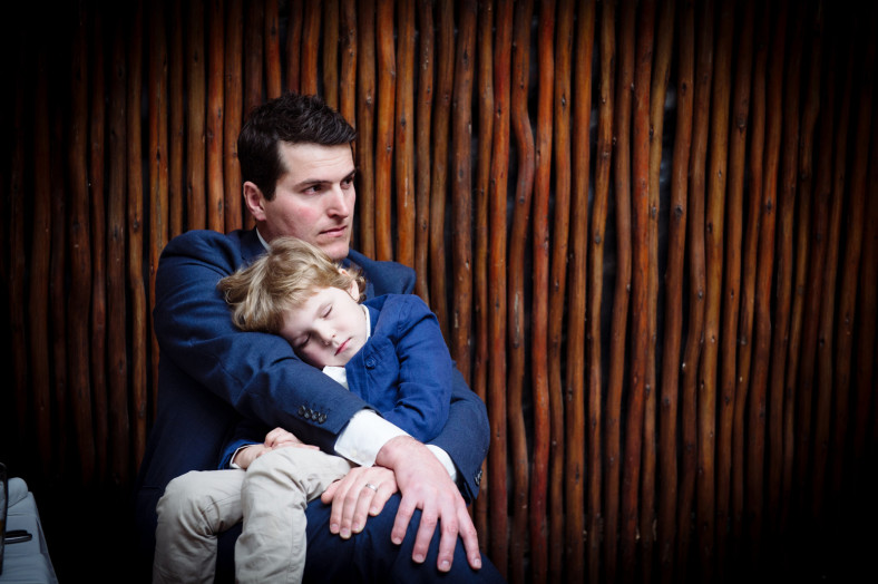 dad with sleeping son