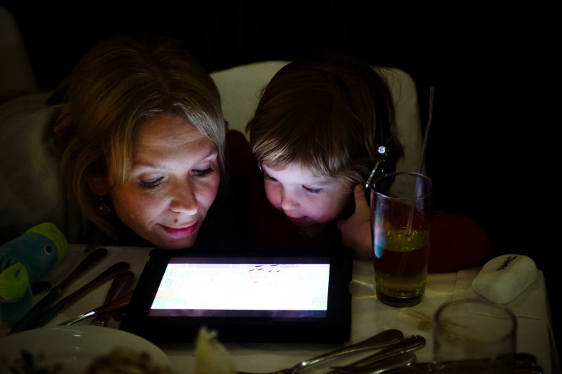 mom and daughter on ipad
