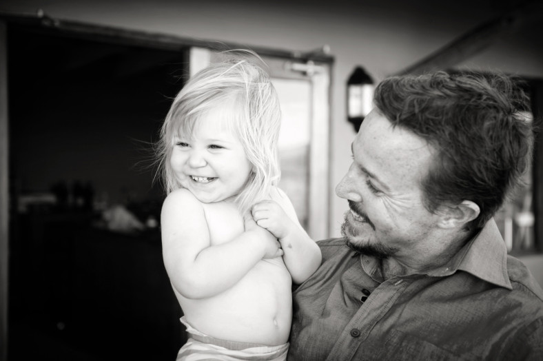 father and laughing daughter