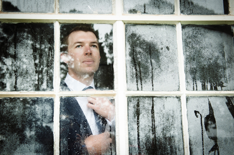 Groom looking outside