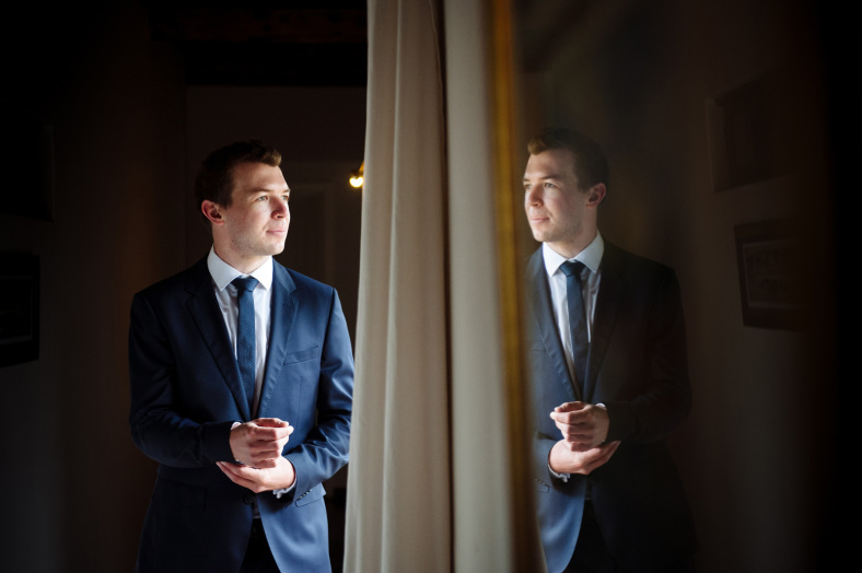 Groom looking outside