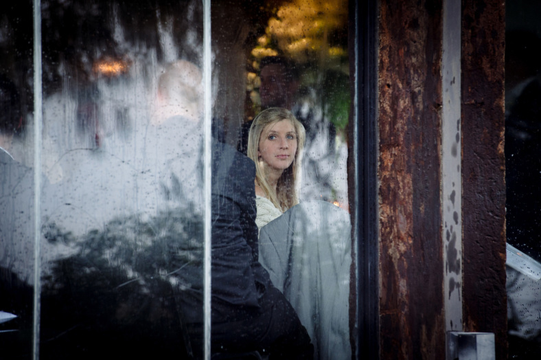 Woman through the wet glass