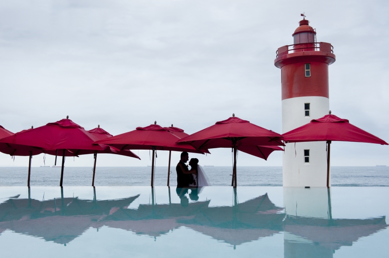 under red umbrellas