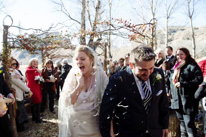 Bride and Groom in lavendar confetti