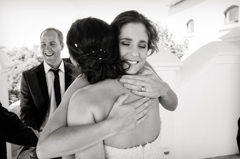 Bride hugs friend