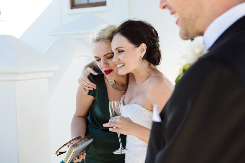 Bride hugs friend
