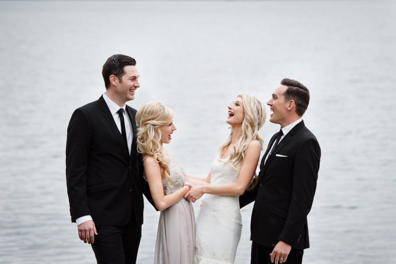 Bride and sister laughing