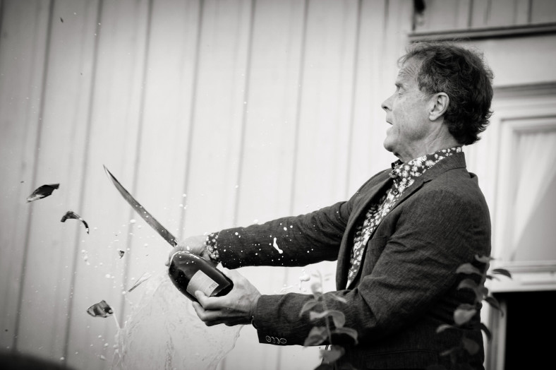Sword breaking a bottle