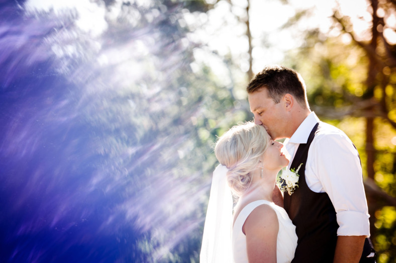 groom kissing the bride