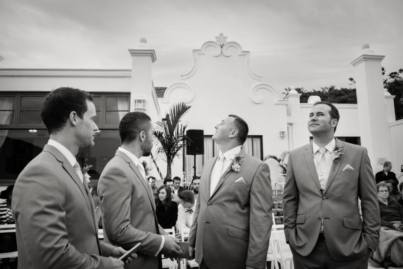 Groomsmen waiting for rain