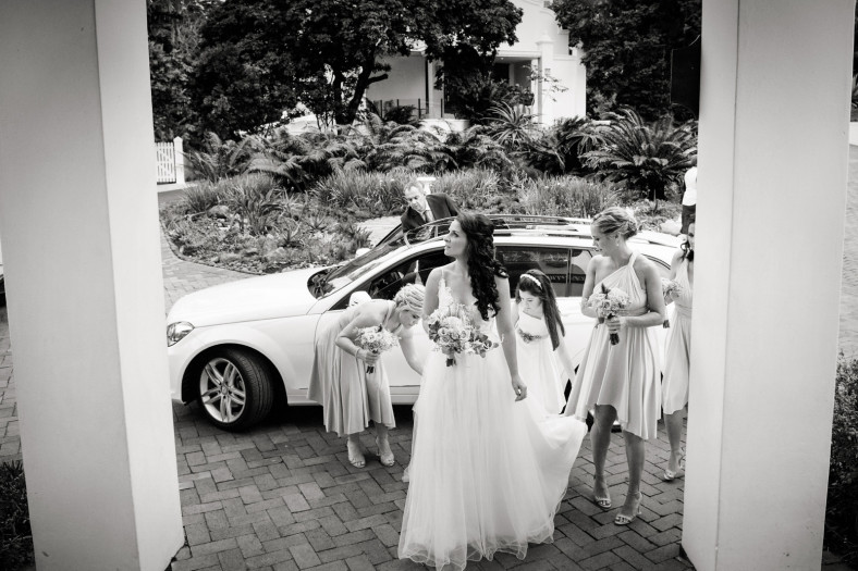 Bride arriving in rain