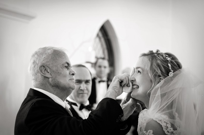 dad wiping brides tears