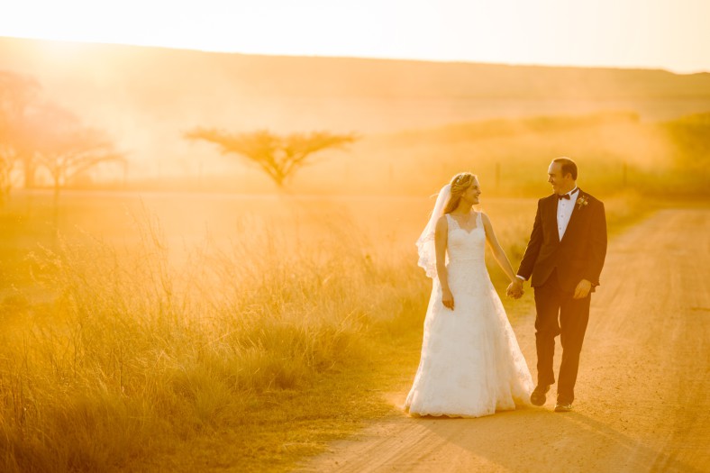golden sunset with bride and groom