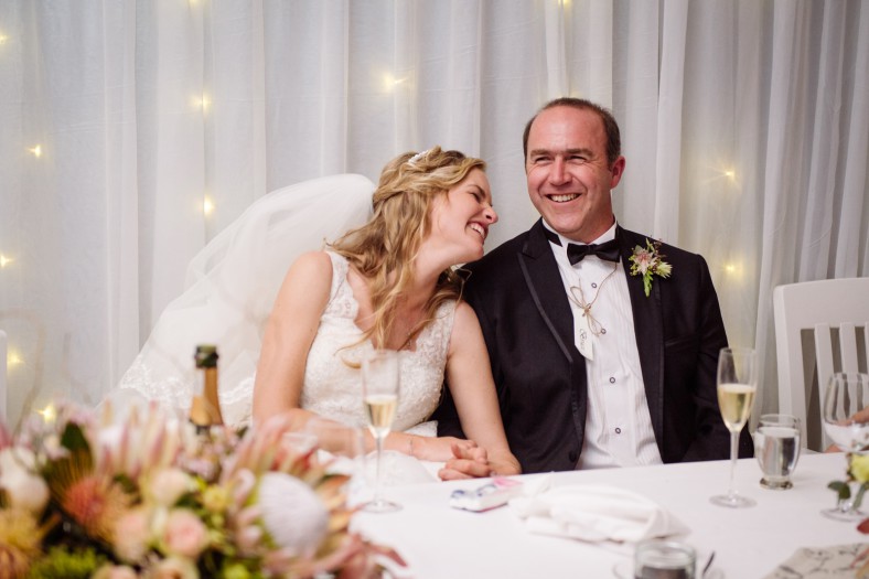 bride and groom laughing