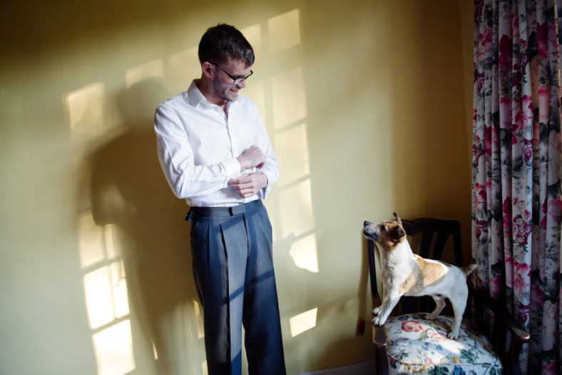 Groom with small dog