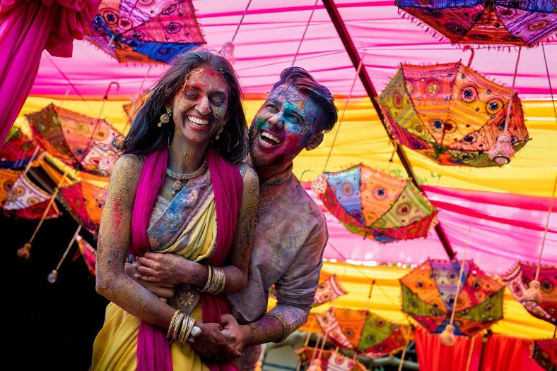 documentary photography of hindu couple covered in holi powder, post holi fight.