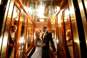 bride and groom in mirrored lift