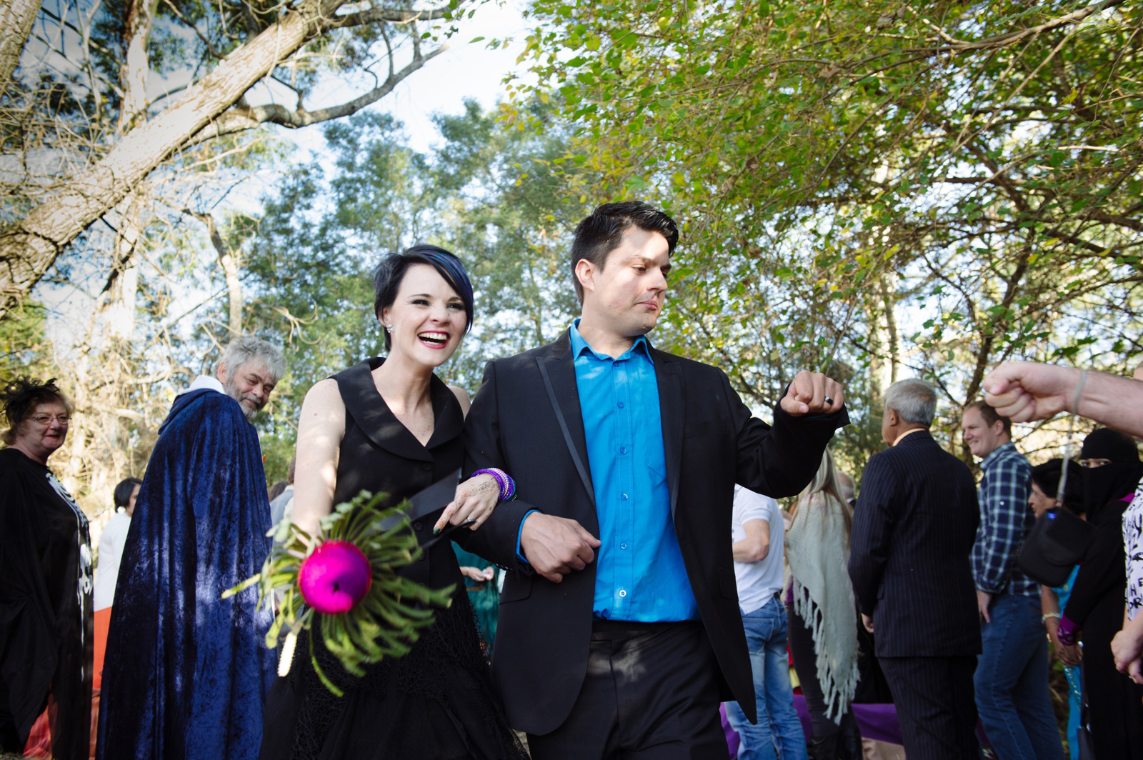 bride in black dress and groom