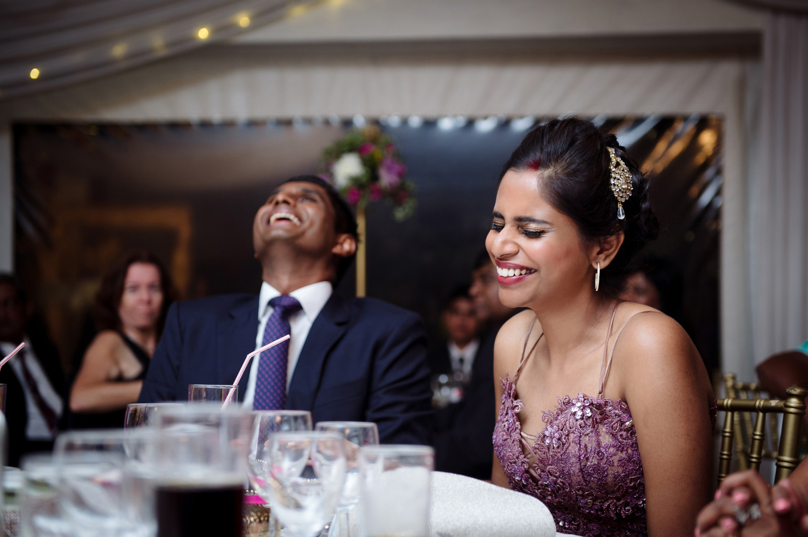 bride and groom laughing at wedding