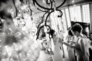 Bride through chandelier